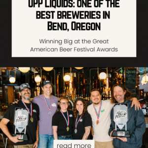 UPP Liquids brewer owners smiling and holding their GABF trophies and wearing their award medals